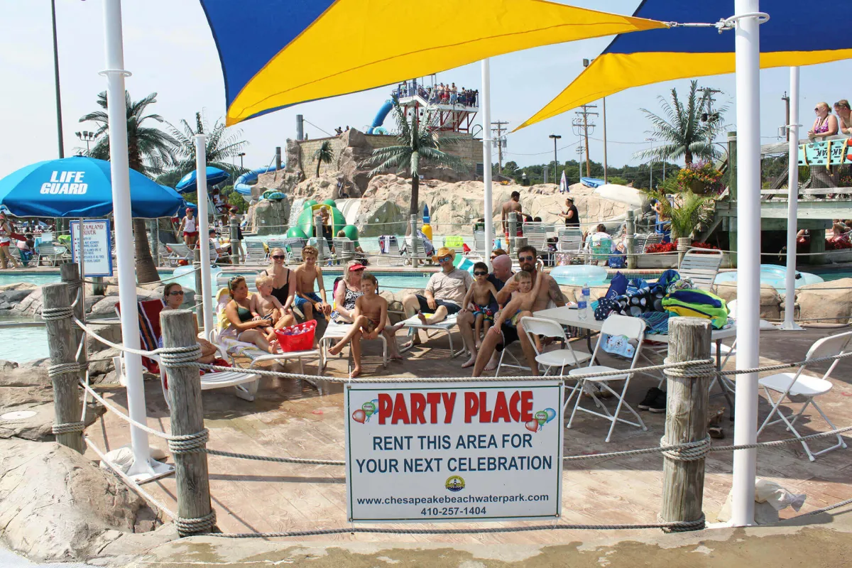 Shaded party place with sail canopies beside the pool